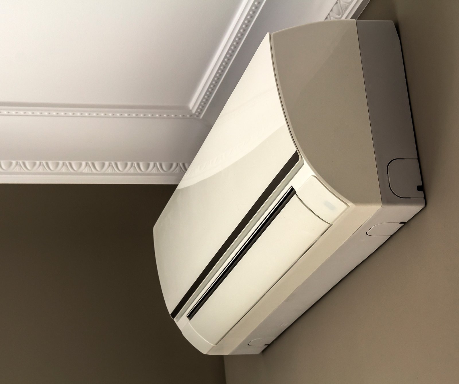 Technician servicing a ductless mini split system in Albuquerque.